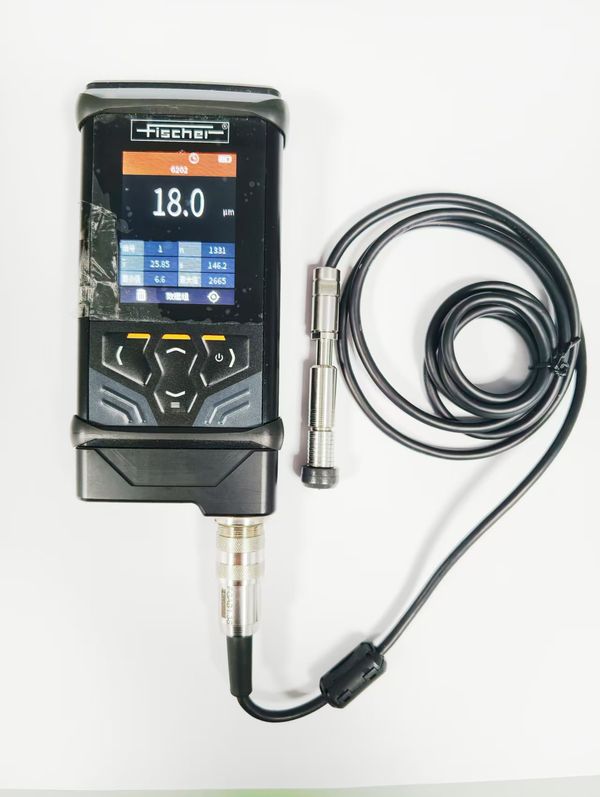 Coating thickness gauge: Fischer (Germany) DUALSCOPE DMP40, combining magnetic and eddy-current principles for non-destructive measurement of black cathodic e-coat dry film thickness; suits ferrous parts such as cold-rolled steel, galvanised steel and silicon steel, and aluminium parts such as die-cast and extruded aluminium
